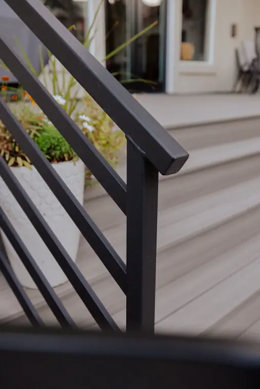 Close view of the Modern flat bars and square post beside a planter